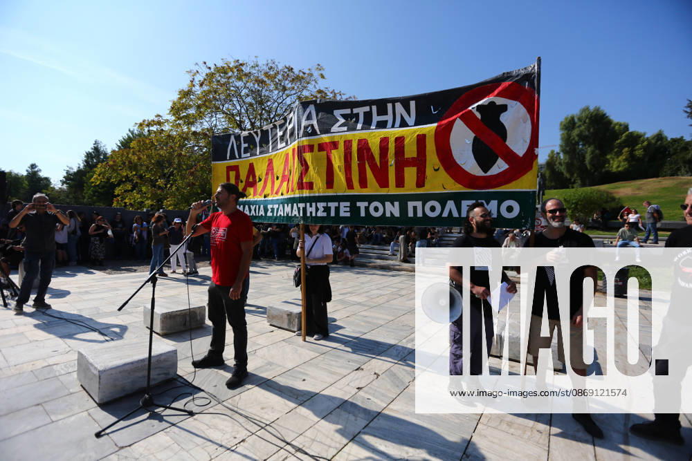 A speaker addresses protesters beneath a large banner calling for freedom for Palestine and an end to the war. Athens GREECE - ZUMAx103 20261010_zip_x103_003