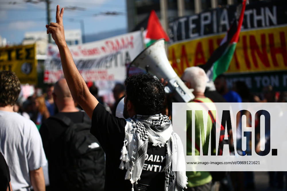 A demonstrator wearing a Palestinian keffiyeh raises a victory sign during a pro-Palestinian protest. Athens GREECE - ZUMAx103 20261010_zip_x103_028