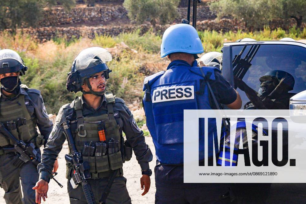 DEIR ABU MASHâ€⠢AL, PALESTINE †OCTOBER 10, 2026: Palestinian farmers came under attack by Israeli settlers and Israeli forces as they headed to harvest olives on their land in Deir Abu Mashâ€⠢al, northwest of Ramallah. The event marked the villageâ€⠢s first olive harvest gathering of the new season. The Palestine Red Crescent Society reported that its teams treated nine people injured during the incident. The injuries included one caused by live ammunition to the thigh, two caused by rubber-coated metal bullets, and six resulting from physical assault. One of those struck by a rubber-coated metal bullet was photojournalist Issam Al-Rimawi. The incident occurred during the annual olive harve - ZUMAq101 20261010_zna_q101_083