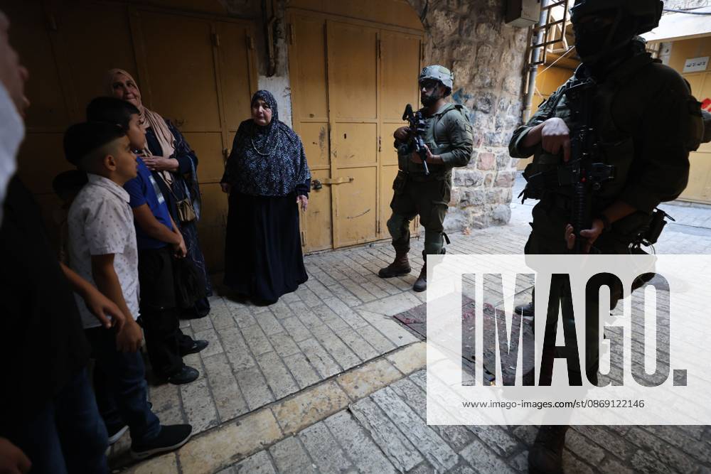 Israeli settlers enter Hebron Old City under military protection HEBRON, OCCUPIED WEST BANK, OCTOBER 10, 2026: Israeli settlers enter Hebron s Old City under the protection of Israeli forces during an organized visit to the area. Israeli soldiers deployed along streets and around the group as settlers moved through the Old City, where Israeli settlers and Palestinian residents live in close proximity amid longstanding tensions and movement restrictions. HEBRON Palestine, State of