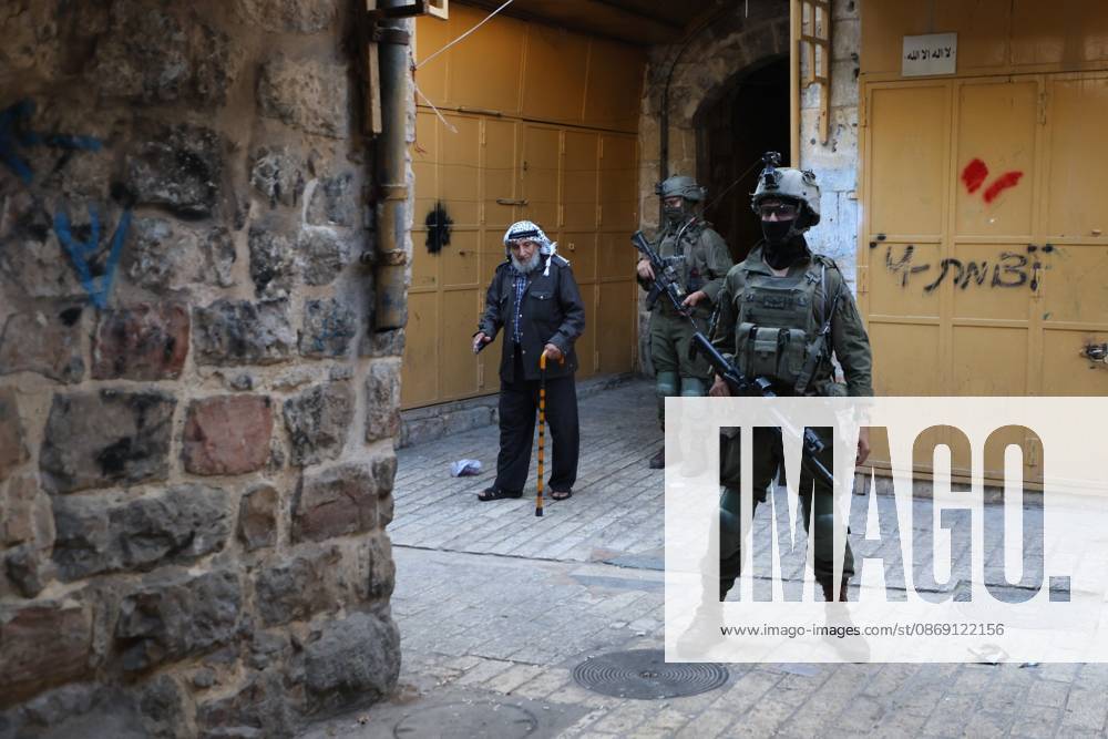 Israeli settlers enter Hebron Old City under military protection HEBRON, OCCUPIED WEST BANK, OCTOBER 10, 2026: Israeli settlers enter Hebron s Old City under the protection of Israeli forces during an organized visit to the area. Israeli soldiers deployed along streets and around the group as settlers moved through the Old City, where Israeli settlers and Palestinian residents live in close proximity amid longstanding tensions and movement restrictions. HEBRON Palestine, State of