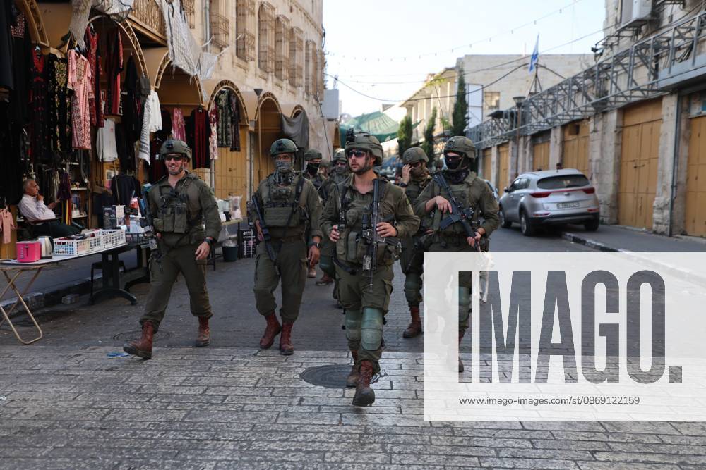 Israeli settlers enter Hebron Old City under military protection HEBRON, OCCUPIED WEST BANK, OCTOBER 10, 2026: Israeli settlers enter Hebron s Old City under the protection of Israeli forces during an organized visit to the area. Israeli soldiers deployed along streets and around the group as settlers moved through the Old City, where Israeli settlers and Palestinian residents live in close proximity amid longstanding tensions and movement restrictions. HEBRON Palestine, State of
