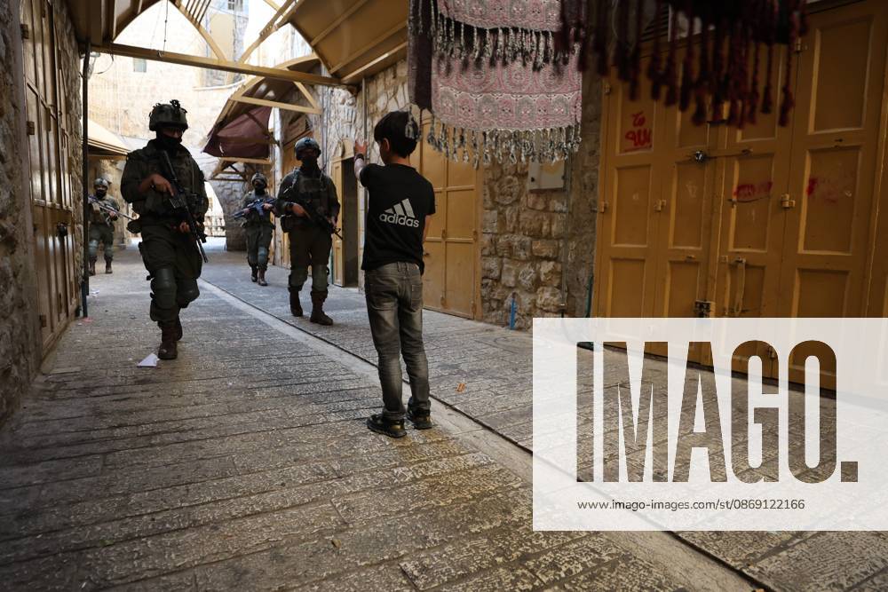 Israeli settlers enter Hebron Old City under military protection HEBRON, OCCUPIED WEST BANK, OCTOBER 10, 2026: Israeli settlers enter Hebron s Old City under the protection of Israeli forces during an organized visit to the area. Israeli soldiers deployed along streets and around the group as settlers moved through the Old City, where Israeli settlers and Palestinian residents live in close proximity amid longstanding tensions and movement restrictions. HEBRON Palestine, State of