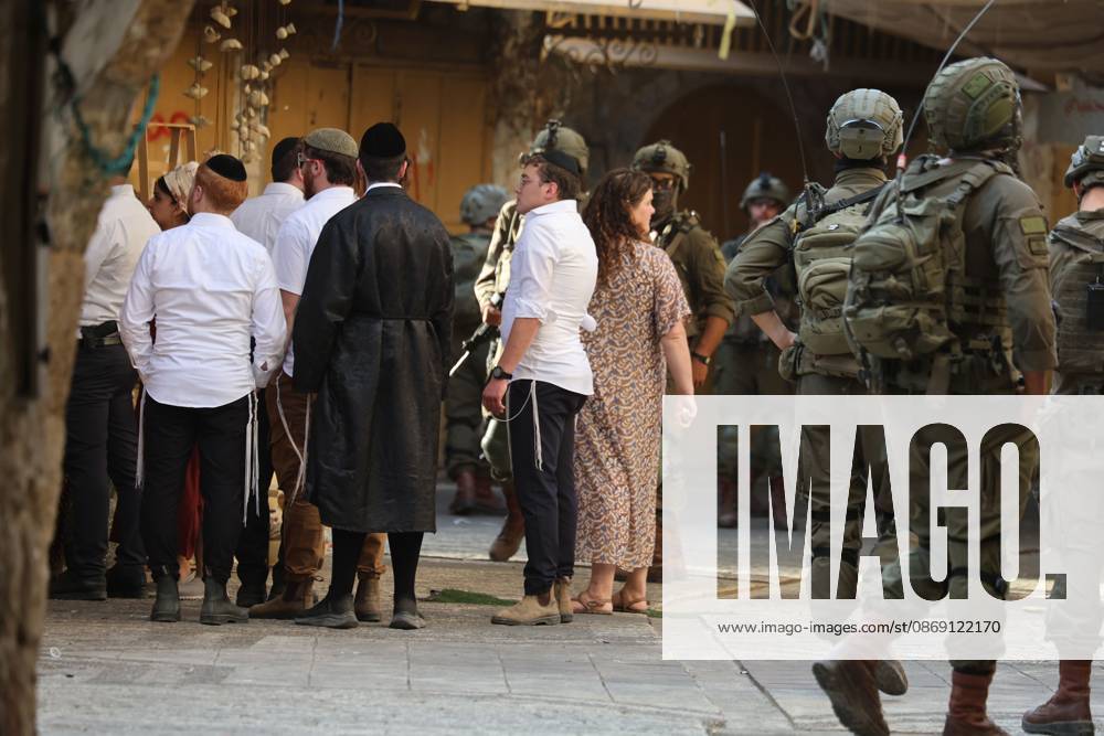 Israeli settlers enter Hebron Old City under military protection HEBRON, OCCUPIED WEST BANK, OCTOBER 10, 2026: Israeli settlers enter Hebron s Old City under the protection of Israeli forces during an organized visit to the area. Israeli soldiers deployed along streets and around the group as settlers moved through the Old City, where Israeli settlers and Palestinian residents live in close proximity amid longstanding tensions and movement restrictions. HEBRON Palestine, State of