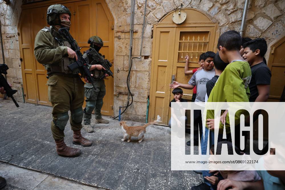 Israeli settlers enter Hebron Old City under military protection HEBRON, OCCUPIED WEST BANK, OCTOBER 10, 2026: Israeli settlers enter Hebron s Old City under the protection of Israeli forces during an organized visit to the area. Israeli soldiers deployed along streets and around the group as settlers moved through the Old City, where Israeli settlers and Palestinian residents live in close proximity amid longstanding tensions and movement restrictions. HEBRON Palestine, State of