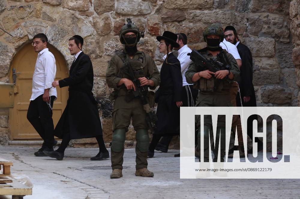 Israeli settlers enter Hebron Old City under military protection HEBRON, OCCUPIED WEST BANK, OCTOBER 10, 2026: Israeli settlers enter Hebron s Old City under the protection of Israeli forces during an organized visit to the area. Israeli soldiers deployed along streets and around the group as settlers moved through the Old City, where Israeli settlers and Palestinian residents live in close proximity amid longstanding tensions and movement restrictions. HEBRON Palestine, State of