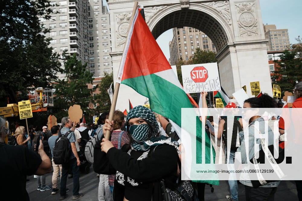 A protester holds a Palestinian flag as hundreds of people attend a Pro-Palestine rally in Washington Square Park on October 10, 2026 in New York. New York USA - ZUMAb148 20261010_zap_b148_073