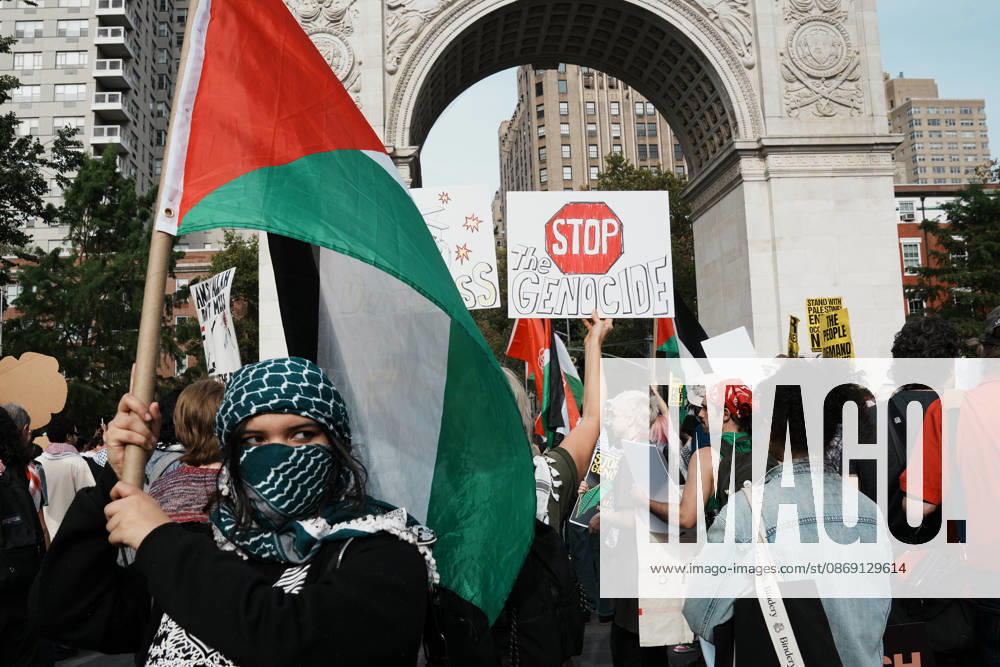 A protester holds a Palestinian flag as hundreds of people attend a Pro-Palestine rally in Washington Square Park on October 10, 2026 in New York. New York USA - ZUMAb148 20261010_zap_b148_074