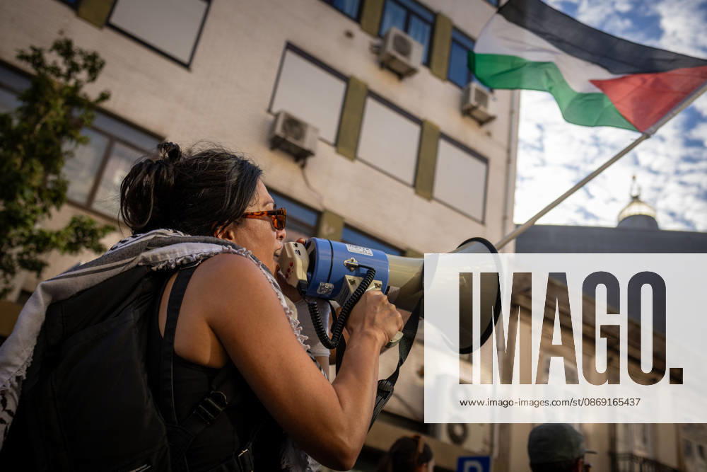 Palestine Solidarity March in Porto - 10 Oct 2026 A demonstrator speaks through a megaphone during a Palestine solidarity demonstration. Hundreds of demonstrators gathered in Porto for a Palestine solidarity march calling for an end to the war in Gaza and support for Palestinian rights. The march began at Praça dos Poveiros and concluded at Praça D. João I. Porto Portugal