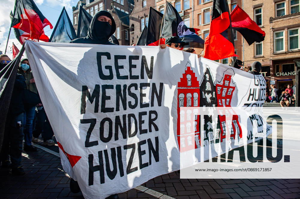 Protesters hold a banner saying No people without houses, during the demonstration. People gathered against the worsening housing crisis. Under the motto Houses for people, not for profit, they demand fundamental changes in Dutch public housing. Amsterdam Netherlands - ZUMAs197 20261010_aaa_s197_539