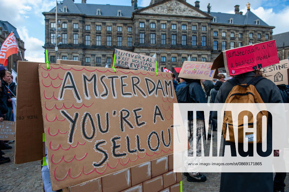 A cardboard house is showing how sell-out Amsterdam is during the demonstration. People gathered against the worsening housing crisis. Under the motto Houses for people, not for profit, they demand fundamental changes in Dutch public housing. Amsterdam Netherlands - ZUMAs197 20261010_aaa_s197_541