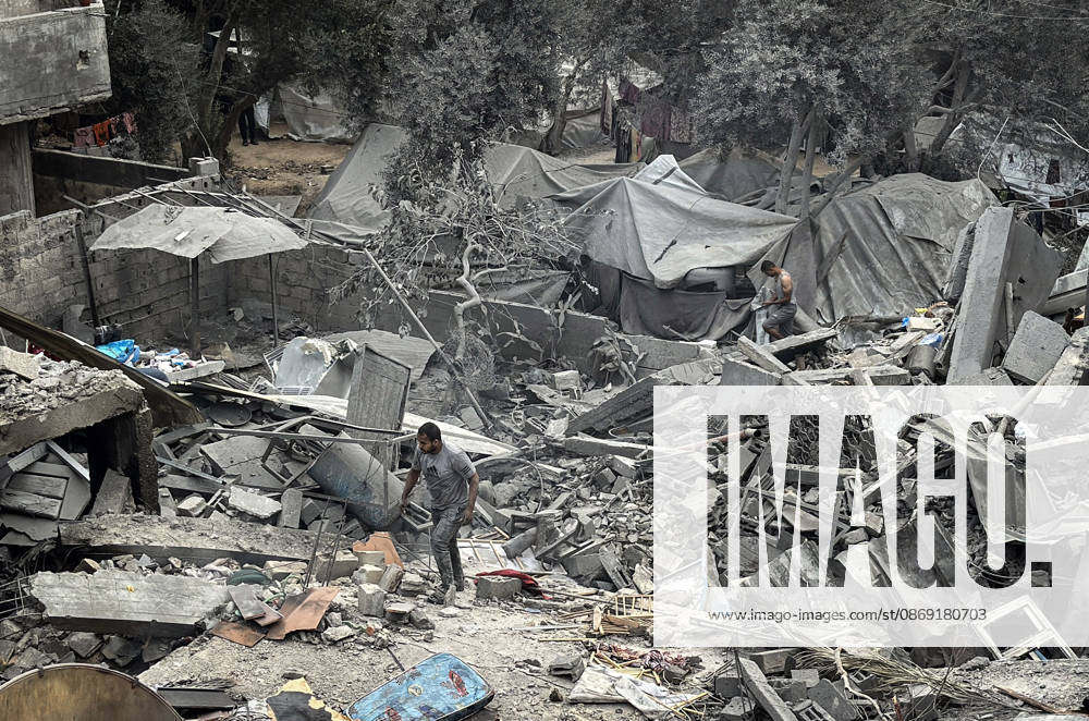 Palestinians Inspect Damage After Strike in Deir al-Balah Palestinians inspect their belongings amid the rubble of damaged residential buildings and their displacement tents after an Israeli airstrike targeted a house in Deir al-Balah, in the central Gaza Strip, on October 11, 2026. Photo by Ahmed Ibrahim apaimages Deir al-Balah Gaza Palestinian Territory 111026_Deir_al-Balah_AI_00(10)
