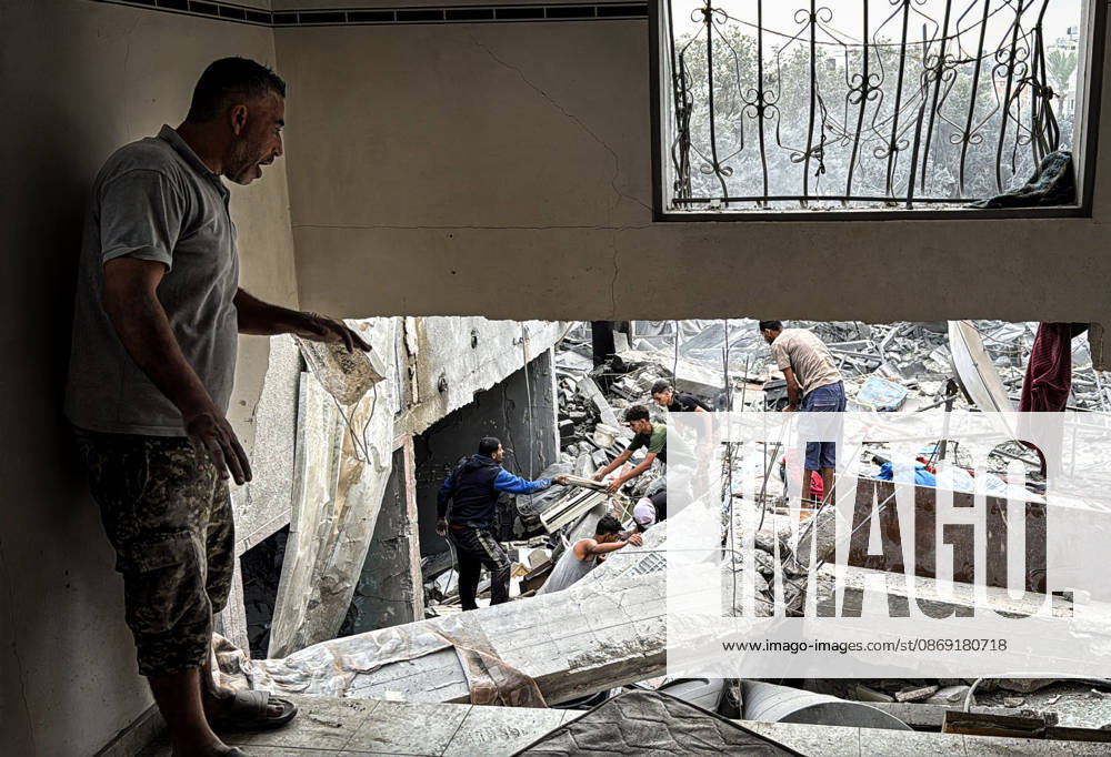 Palestinians Inspect Damage After Strike in Deir al-Balah Palestinians inspect their belongings amid the rubble of damaged residential buildings and their displacement tents after an Israeli airstrike targeted a house in Deir al-Balah, in the central Gaza Strip, on October 11, 2026. Photo by Ahmed Ibrahim apaimages Deir al-Balah Gaza Palestinian Territory 111026_Deir_al-Balah_AI_00(11)