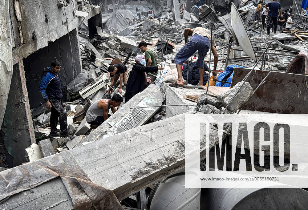 Palestinians Inspect Damage After Strike in Deir al-Balah Palestinians inspect their belongings amid the rubble of damaged residential buildings and their displacement tents after an Israeli airstrike targeted a house in Deir al-Balah, in the central Gaza Strip, on October 11, 2026. Photo by Ahmed Ibrahim apaimages Deir al-Balah Gaza Palestinian Territory 111026_Deir_al-Balah_AI_00(12)