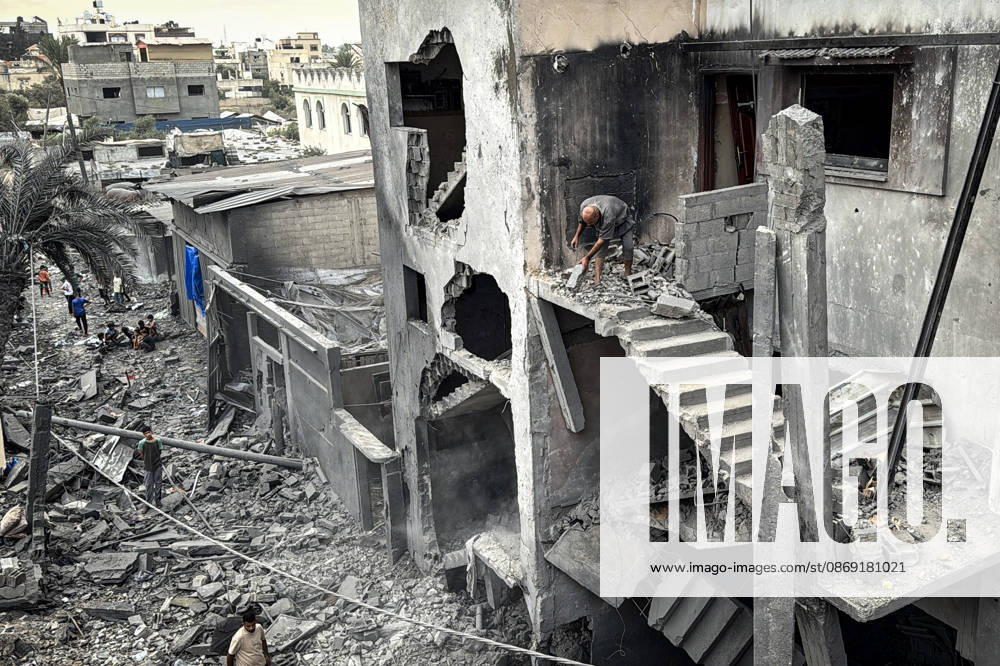 Palestinians Inspect Damage After Strike in Deir al-Balah Palestinians inspect their belongings amid the rubble of damaged residential buildings and their displacement tents after an Israeli airstrike targeted a house in Deir al-Balah, in the central Gaza Strip, on October 11, 2026. Photo by Ahmed Ibrahim apaimages Deir al-Balah Gaza Palestinian Territory 111026_Deir_al-Balah_AI_00(9)
