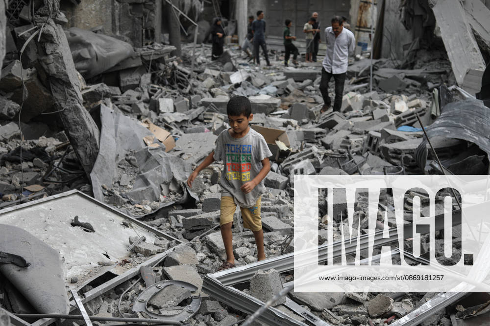 Israeli attack on Az-Zawayda area in Gaza DEIR AL-BALAH, GAZA, PALESTINE - OCTOBER 11: A Palestinian boy walks among the rubble of destroyed buildings following an Israeli airstrike targeting a building belonging to the Buheysi family in the town of Az-Zawayda, near Deir al-Balah in the central Gaza Strip, on October 11, 2026. Israeli forces carried out the strike despite the ceasefire, destroying the targeted building and damaging surrounding structures. Adam Bilal Anadolu Deir Al-Balah Gaza. Editorial use only. Please get in touch for any other usage.