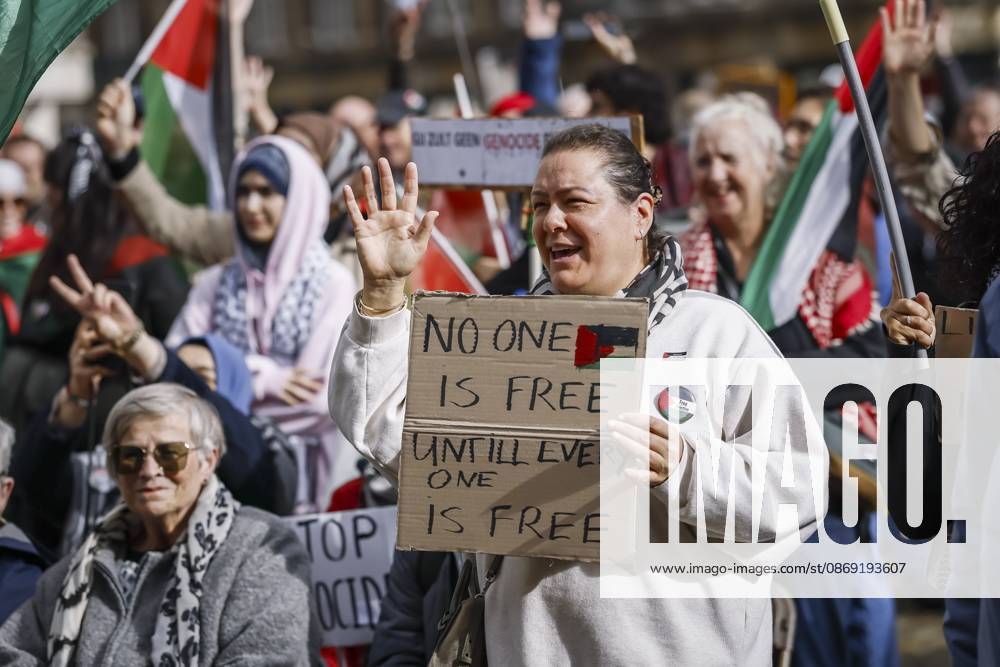 AMSTERDAM - Demonstrators during a national protest on Dam Square marking the conclusion of the nationwide week of action for sanctions against Israel. According to various activist groups, despite the ceasefire , the genocide against the Palestinian people continues unabated. KOEN VAN WEEL ANP netherlands out - belgium out