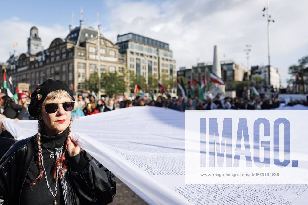 AMSTERDAM - Demonstrators during a national protest on Dam Square marking the conclusion of the nationwide week of action for sanctions against Israel. According to various activist groups, despite the ceasefire , the genocide against the Palestinian people continues unabated. KOEN VAN WEEL ANP netherlands out - belgium out