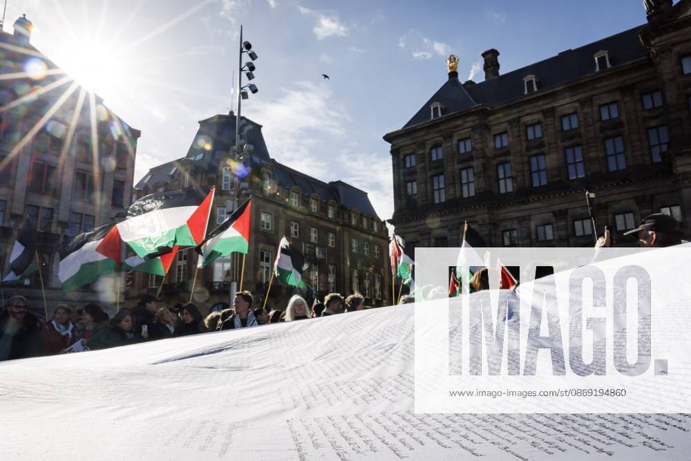 AMSTERDAM - Demonstrators during a national protest on Dam Square marking the conclusion of the nationwide week of action for sanctions against Israel. According to various activist groups, despite the ceasefire , the genocide against the Palestinian people continues unabated. KOEN VAN WEEL ANP netherlands out - belgium out