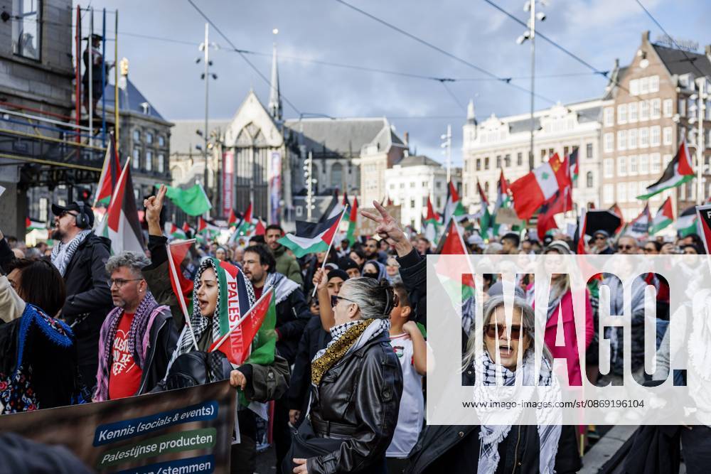AMSTERDAM - Demonstrators during a national protest on Dam Square marking the conclusion of the nationwide week of action for sanctions against Israel. According to various activist groups, despite the ceasefire , the genocide against the Palestinian people continues unabated. KOEN VAN WEEL ANP netherlands out - belgium out