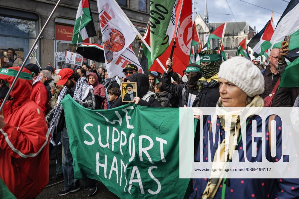 AMSTERDAM - Demonstrators during a national protest on Dam Square marking the conclusion of the nationwide week of action for sanctions against Israel. According to various activist groups, despite the ceasefire , the genocide against the Palestinian people continues unabated. KOEN VAN WEEL ANP netherlands out - belgium out