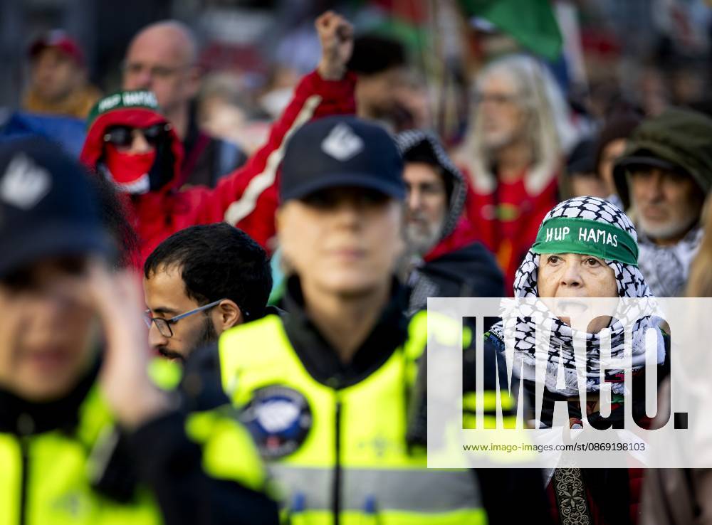 AMSTERDAM - Demonstrators during a national protest on Dam Square marking the conclusion of the nationwide week of action for sanctions against Israel. According to various activist groups, despite the ceasefire , the genocide against the Palestinian people continues unabated. KOEN VAN WEEL ANP netherlands out - belgium out
