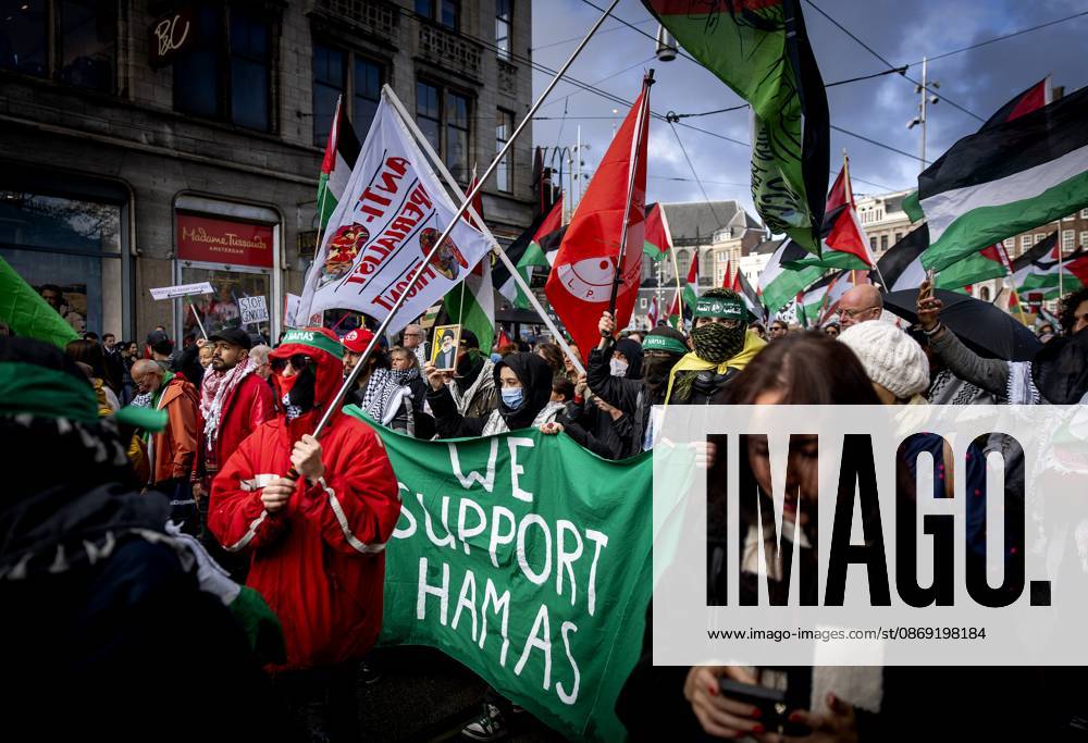AMSTERDAM - Demonstrators during a national protest on Dam Square marking the conclusion of the nationwide week of action for sanctions against Israel. According to various activist groups, despite the ceasefire , the genocide against the Palestinian people continues unabated. KOEN VAN WEEL ANP netherlands out - belgium out