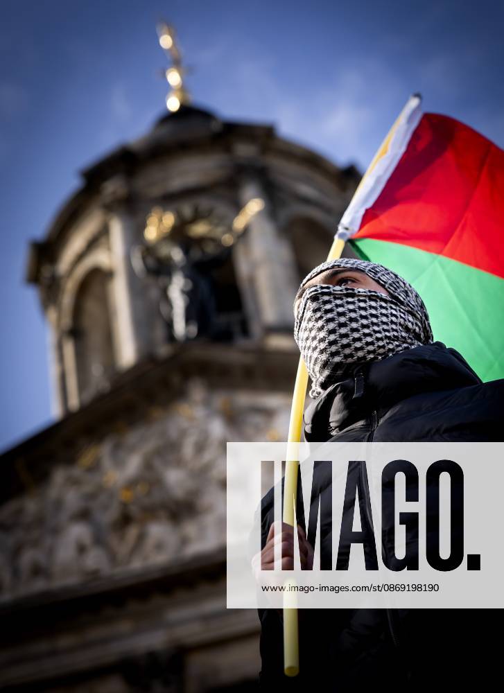 AMSTERDAM - Demonstrators during a national protest on Dam Square marking the conclusion of the nationwide week of action for sanctions against Israel. According to various activist groups, despite the ceasefire , the genocide against the Palestinian people continues unabated. KOEN VAN WEEL ANP netherlands out - belgium out