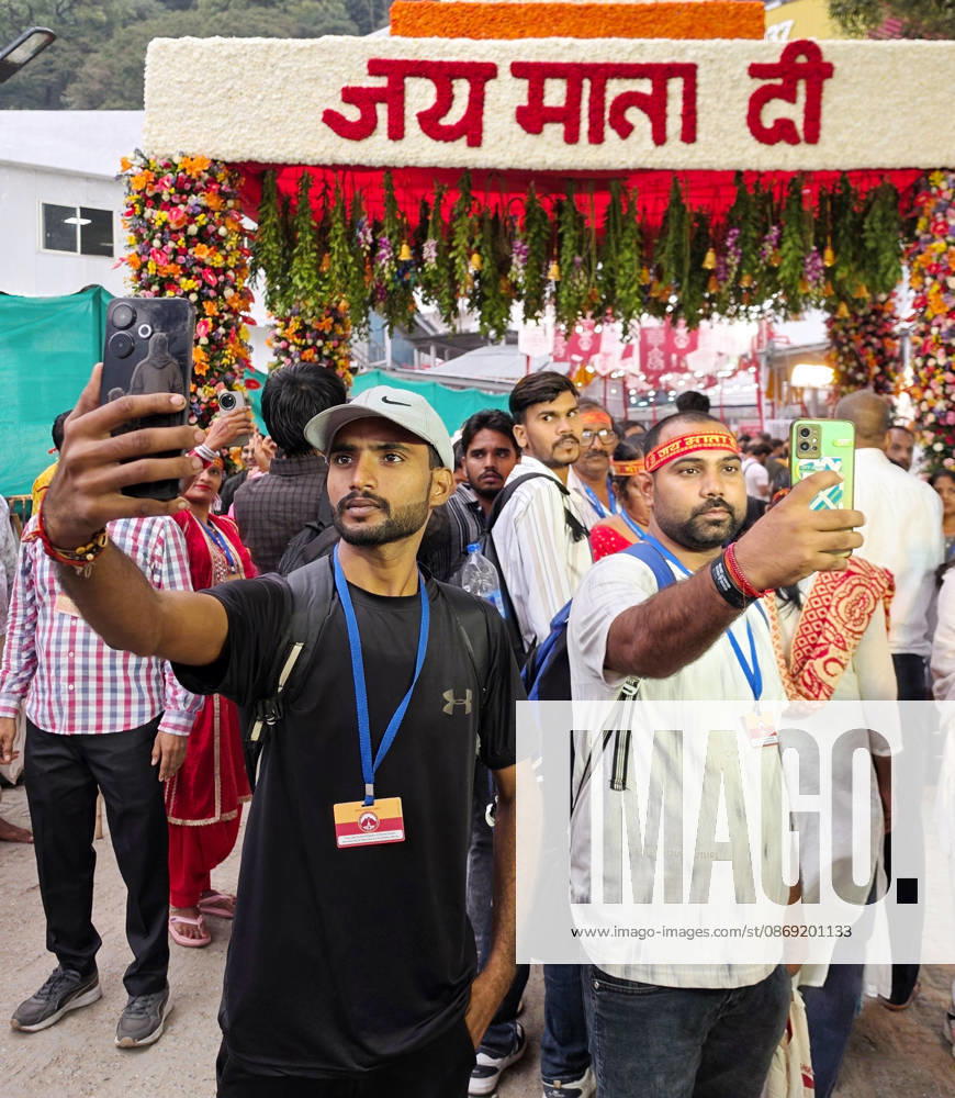 Hindu Devotees Gather at the Mata Vaishno Devi Shrine Katra, Oct 11 (ANI): Hindu devotees pose for a picture during their journey on the occasion of Shardiya Navratri to seek the blessings of Goddess Durga at the Mata Vaishno Devi Temple, in Katra on Sunday. Katra Jammu and Kashmir India