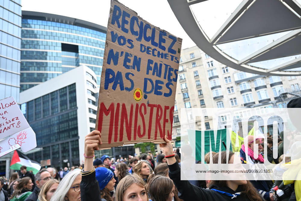 Tens of thousands march in Brussels demanding stronger climate action BRUSSELS, BELGIUM - OCTOBER 11: Demonstrators hold climate-themed placards as tens of thousands of people march through Brussels calling for stronger action against climate change and reduced dependence on fossil fuels, on October 11, 2026 in Brussels, Belgium. The protest was organized by the Belgian Climate Coalition, which brings together around 100 civil society organizations. Participants marched along major roads toward Schuman Square, home to several European Union institutions, while protesting the government s climate policies. Dursun Aydemir Anadolu Brussels Belgium. Editorial use only. Please get in touch for any other usage.
