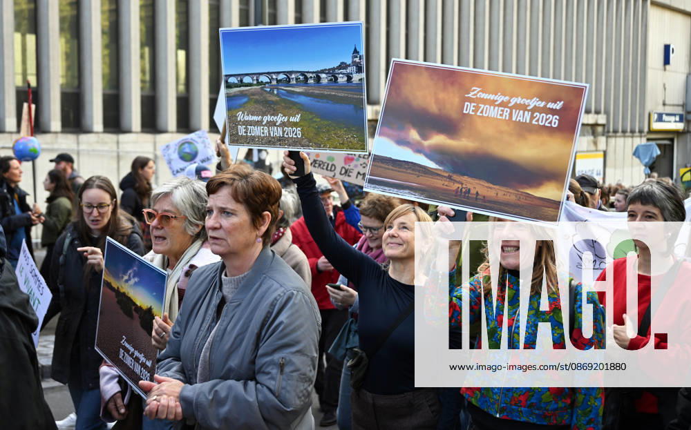 Tens of thousands march in Brussels demanding stronger climate action BRUSSELS, BELGIUM - OCTOBER 11: Demonstrators hold climate-themed placards as tens of thousands of people march through Brussels calling for stronger action against climate change and reduced dependence on fossil fuels, on October 11, 2026 in Brussels, Belgium. The protest was organized by the Belgian Climate Coalition, which brings together around 100 civil society organizations. Participants marched along major roads toward Schuman Square, home to several European Union institutions, while protesting the government s climate policies. Dursun Aydemir Anadolu Brussels Belgium. Editorial use only. Please get in touch for any other usage.