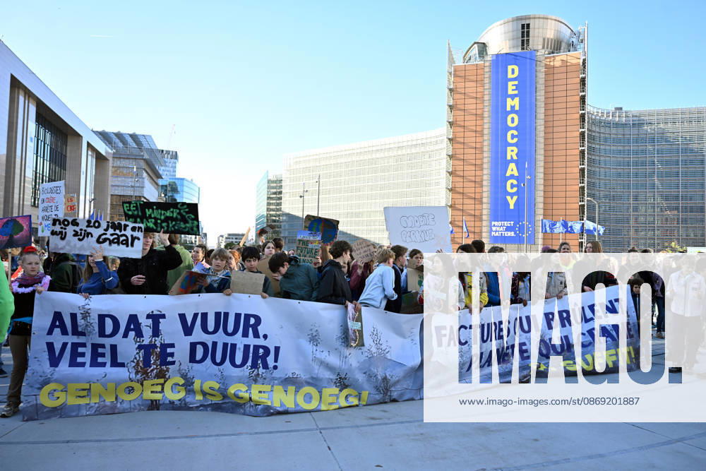 Tens of thousands march in Brussels demanding stronger climate action BRUSSELS, BELGIUM - OCTOBER 11: Demonstrators hold climate-themed placards as tens of thousands of people march through Brussels calling for stronger action against climate change and reduced dependence on fossil fuels, on October 11, 2026 in Brussels, Belgium. The protest was organized by the Belgian Climate Coalition, which brings together around 100 civil society organizations. Participants marched along major roads toward Schuman Square, home to several European Union institutions, while protesting the government s climate policies. Dursun Aydemir Anadolu Brussels Belgium. Editorial use only. Please get in touch for any other usage.