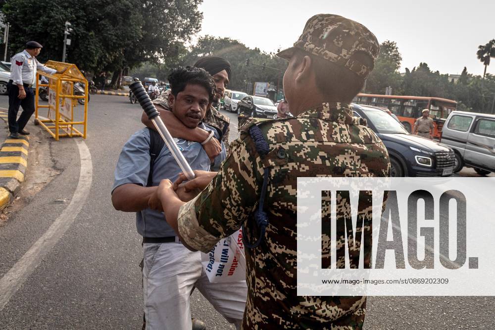 Protest to demand resignation of India s chief election commissioner in New Delhi NEW DELHI, INDIA - OCTOBER 11: Indian police officers detain a protestor during a mass protest organized by the Cockroach Janta Party (CJP) in New Delhi, India on October 11, 2026. Demonstrators gathered to demand the resignation of Chief Election Commissioner Gyanesh Kumar over alleged electoral roll irregularities and revisions. Yousuf Sarfaraz Anadolu New Delhi India. Editorial use only. Please get in touch for any other usage.