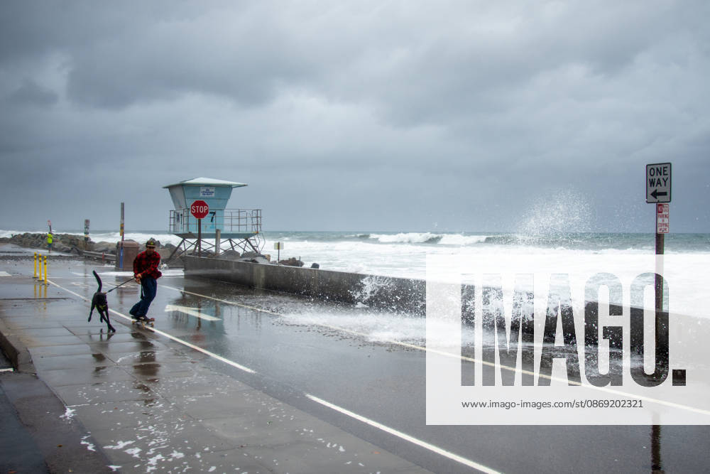 An Oceanside man and his dog brave historic El NioÂ±o tidal swells on October 10, 2026. These Kelvin Waves have brought major damages to the Southern California coastline. Oceanside USA - ZUMAg219 20261011_znp_g219_009