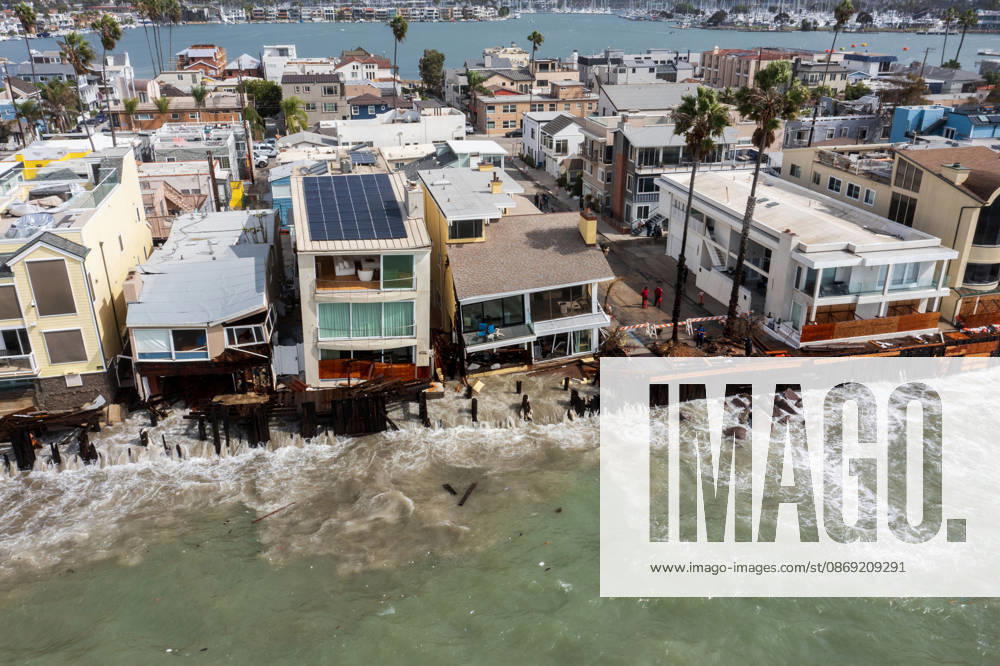The Long Beach Peninsula is facing severe, structural devastation as Tropical Storm Rachel batters the Southern California coast. Driven by a developing El Nino pattern, this is the fourth major storm system to slam the shoreline in six weeks. Waves and unusually high tides have shattered a 30-foot section of the protective wooden bulkhead, completely shredding the historic boardwalk and allowing seawater to surge directly onto interior streets. Flooding has swamped coastal neighborhoods, forcing mandatory evacuations along oceanfront blocks like Seaside Walk. Emergency crews are working to stack thousands of sandbags and reinforce coastal defenses, but city inspectors have already been forced - ZUMAr19_ 20261011_new_r19_133