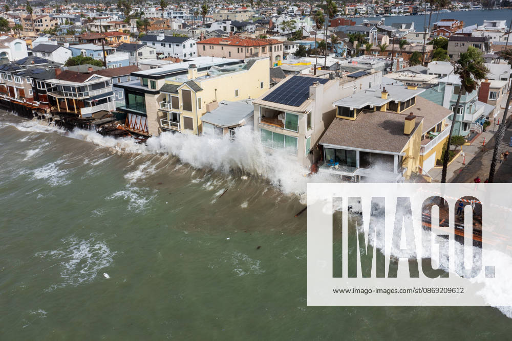 The Long Beach Peninsula is facing severe, structural devastation as Tropical Storm Rachel batters the Southern California coast. Driven by a developing El Nino pattern, this is the fourth major storm system to slam the shoreline in six weeks. Waves and unusually high tides have shattered a 30-foot section of the protective wooden bulkhead, completely shredding the historic boardwalk and allowing seawater to surge directly onto interior streets. Flooding has swamped coastal neighborhoods, forcing mandatory evacuations along oceanfront blocks like Seaside Walk. Emergency crews are working to stack thousands of sandbags and reinforce coastal defenses, but city inspectors have already been forced - ZUMAr19_ 20261011_new_r19_131