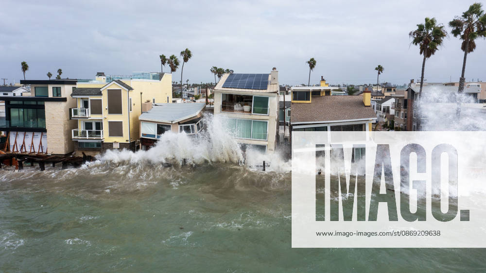 The Long Beach Peninsula is facing severe, structural devastation as Tropical Storm Rachel batters the Southern California coast. Driven by a developing El Nino pattern, this is the fourth major storm system to slam the shoreline in six weeks. Waves and unusually high tides have shattered a 30-foot section of the protective wooden bulkhead, completely shredding the historic boardwalk and allowing seawater to surge directly onto interior streets. Flooding has swamped coastal neighborhoods, forcing mandatory evacuations along oceanfront blocks like Seaside Walk. Emergency crews are working to stack thousands of sandbags and reinforce coastal defenses, but city inspectors have already been forced - ZUMAr19_ 20261011_new_r19_143