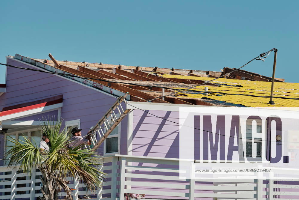 Pensacola Beach, Florida, U.S: October 11, 2026 Pensacola Beach, Florida USA: Contractors get on the roof to inspect itâ€⠢s damage after the arrival of Hurricane Isaias. Pensacola Beach U.S - ZUMAa14_ 20261011_zaf_a14_016