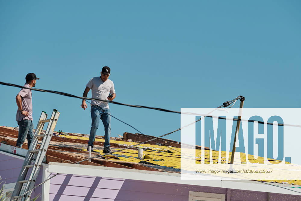 Pensacola Beach, Florida, U.S: October 11, 2026 Pensacola Beach, Florida USA: Contractors get on the roof to inspect itÃ¢â‚¬â ¢s damage after the arrival of Hurricane Isaias. Pensacola Beach U.S - ZUMAa14_ 20261011_zaf_a14_020