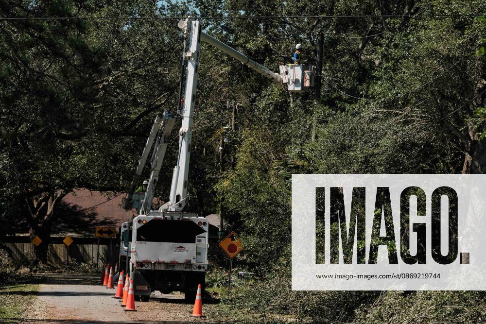 Pensacola, Florida, U.S: October 11, 2026 Pensacola, Florida USA: Line workers try and remove fallen tree limbs from power lines after the arrival of Hurricane Isaias. Pensacola U.S - ZUMAa14_ 20261011_zaf_a14_021