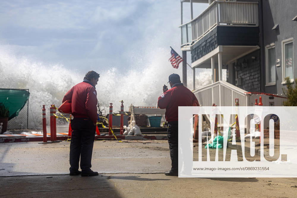 Waves crash into the boardwalk along the Belmont Shore peninsula while Long Beach City Lifeguards watch as remnants of Tropical Storm Rachel make their way through Southern California. Long Beach USA - ZUMAc316 20261011_znp_c316_001