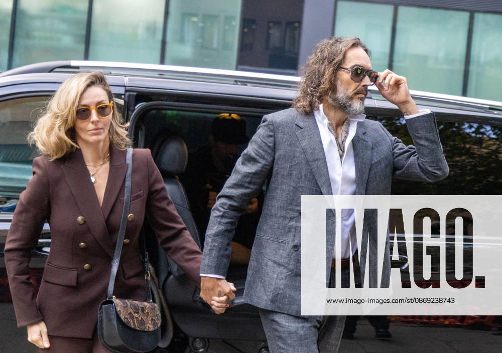 RUSSELL BRAND with his wife LAURA arrives at Southwark Crown Court, where he is facing three charges of rape, indecent assault, and three counts of sexual assault, relating to six women. London United Kingdom - ZUMAs262 20261012_zip_s262_011