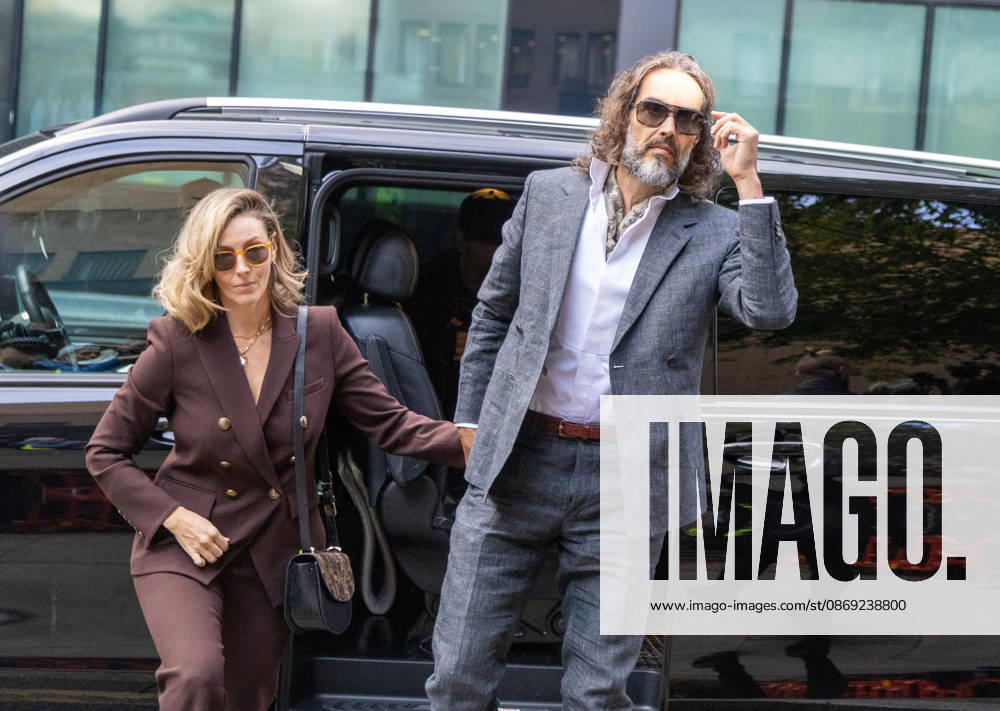 RUSSELL BRAND with his wife LAURA arrives at Southwark Crown Court, where he is facing three charges of rape, indecent assault, and three counts of sexual assault, relating to six women. London United Kingdom - ZUMAs262 20261012_zip_s262_014