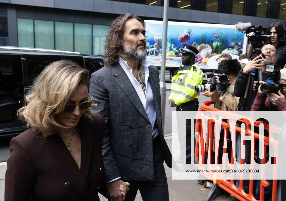 RUSSELL BRAND with his wife LAURA arrives at Southwark Crown Court, where he is facing three charges of rape, indecent assault, and three counts of sexual assault, relating to six women. London United Kingdom - ZUMAs262 20261012_zip_s262_015