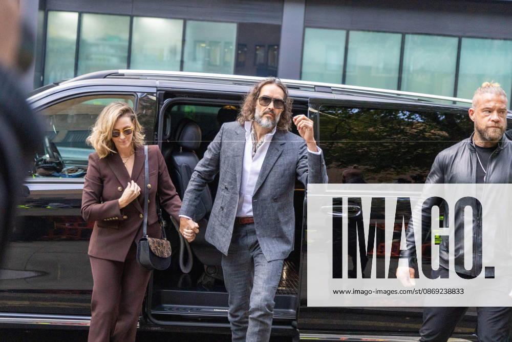 RUSSELL BRAND with his wife LAURA arrives at Southwark Crown Court, where he is facing three charges of rape, indecent assault, and three counts of sexual assault, relating to six women. London United Kingdom - ZUMAs262 20261012_zip_s262_018