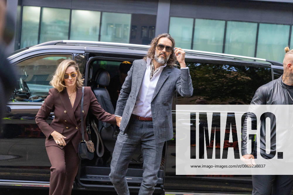 RUSSELL BRAND with his wife LAURA arrives at Southwark Crown Court, where he is facing three charges of rape, indecent assault, and three counts of sexual assault, relating to six women. London United Kingdom - ZUMAs262 20261012_zip_s262_019