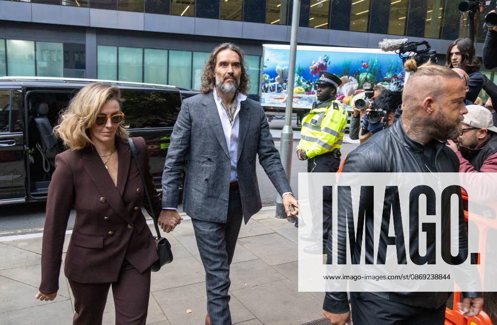 RUSSELL BRAND with his wife LAURA arrives at Southwark Crown Court, where he is facing three charges of rape, indecent assault, and three counts of sexual assault, relating to six women. London United Kingdom - ZUMAs262 20261012_zip_s262_021