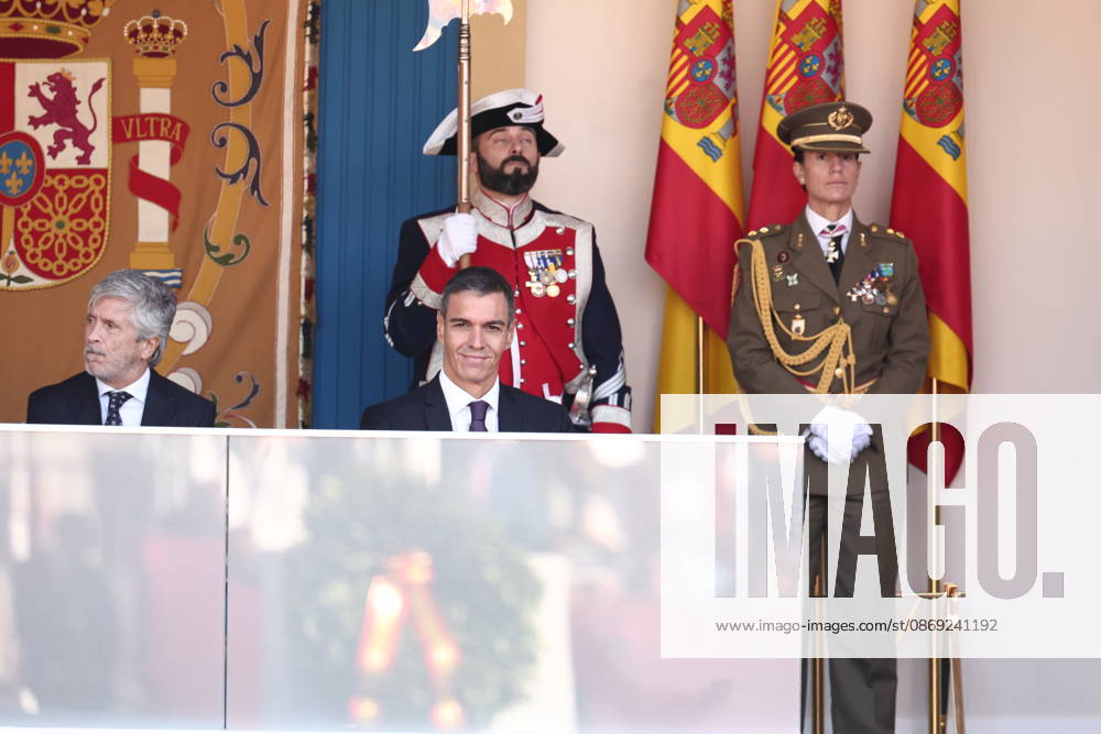 October 12 Parade for Hispanic Heritage Day: Interior Minister Fernando Grande Marlaska, and Prime Minister Pedro Sánchez, during the solemn ceremony honoring the national flag and the military parade for October 12, Hispanic Heritage Day, in Plaza de Cánovas del Castillo, on October 12, 2026, in Madrid, Spain. The events begin with the flag-raising ceremony and are followed by a tribute to those who gave their lives for the country. Subsequently, the military air and ground parades begin. Approximately 4,400 members of the Armed Forces, the security forces, and various civilian public institutions are participating this year in the parade presided over by the King and Queen. The aerial parade featured 50 fighter, training, and transport a