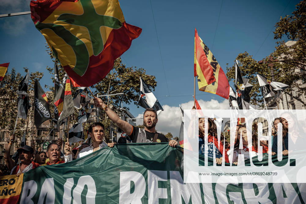 Demonstrators chant slogans behind a banner during a rally marking Spainâ€⠢s National Day. Barcelona Spain - ZUMAo105 20261012_fap_o105_007