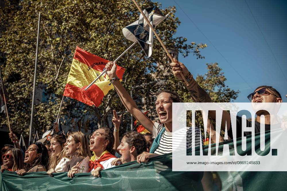 Demonstrators chant slogans behind a banner during a rally marking Spainâ€⠢s National Day. Barcelona Spain - ZUMAo105 20261012_fap_o105_011